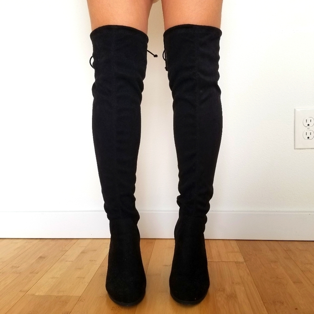Over-the-knee black boots.